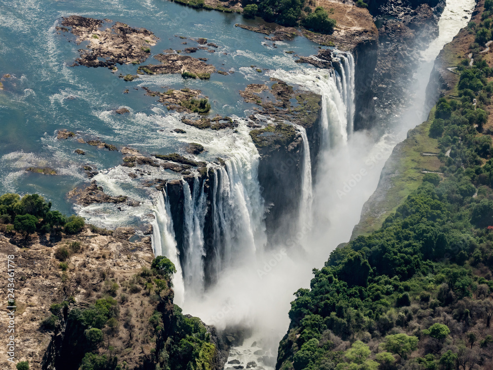 Fototapeta premium Awesome aerial view of Victorian waterfalls. View from helicopter. The Victoria Falls in Zimbabwe.