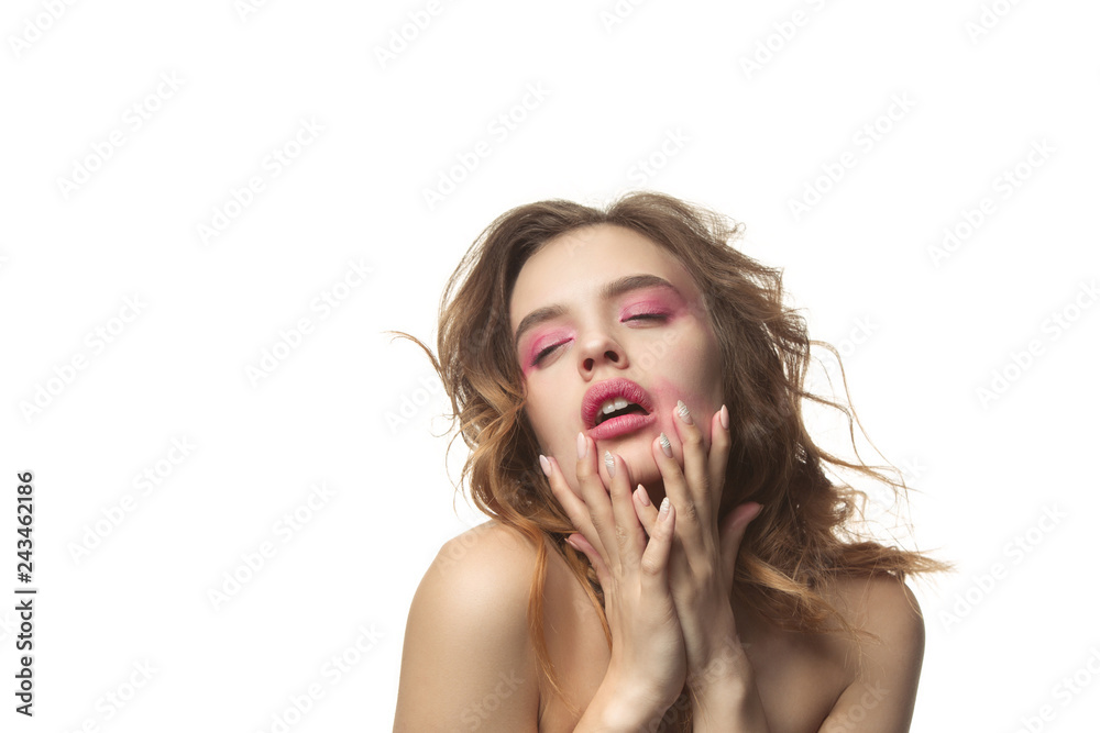 Fototapeta premium Nice young woman with long wavy silky hair, natural make up looking at camera with hand near chin isolated on white background. Model with natural make-up. People emotions and Valentines Day concept