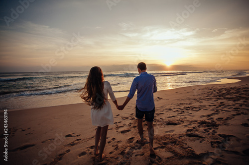 Rear View Of Girl And Boy Embrace Each Other Silhouette Of Young Couple Walking On Beach At Amazing Sunset Holding Hands Horizontally Framed Shot Stock Photo Adobe Stock Rear View Of Girl And Boy Embrace Each Other Silhouette Of Young Couple Walking On Beach At Amazing Sunset Holding Hands Horizontally Framed Shot Stock Photo Adobe Stock