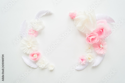 white and pink paper flowers on the white background