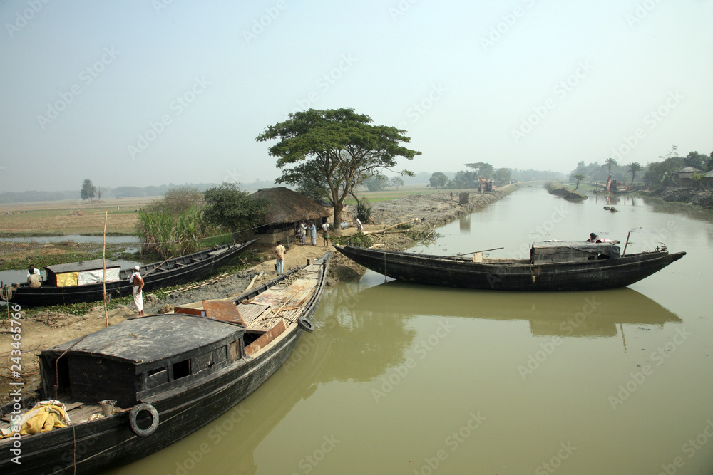 Traditional fishing boat in the delta of the Ganges River in Sundarbans Jungle National Park in India