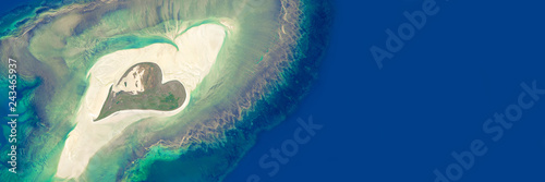 Aerial view of an island in the shape of a heart - Elements of this image are furnished by NASA