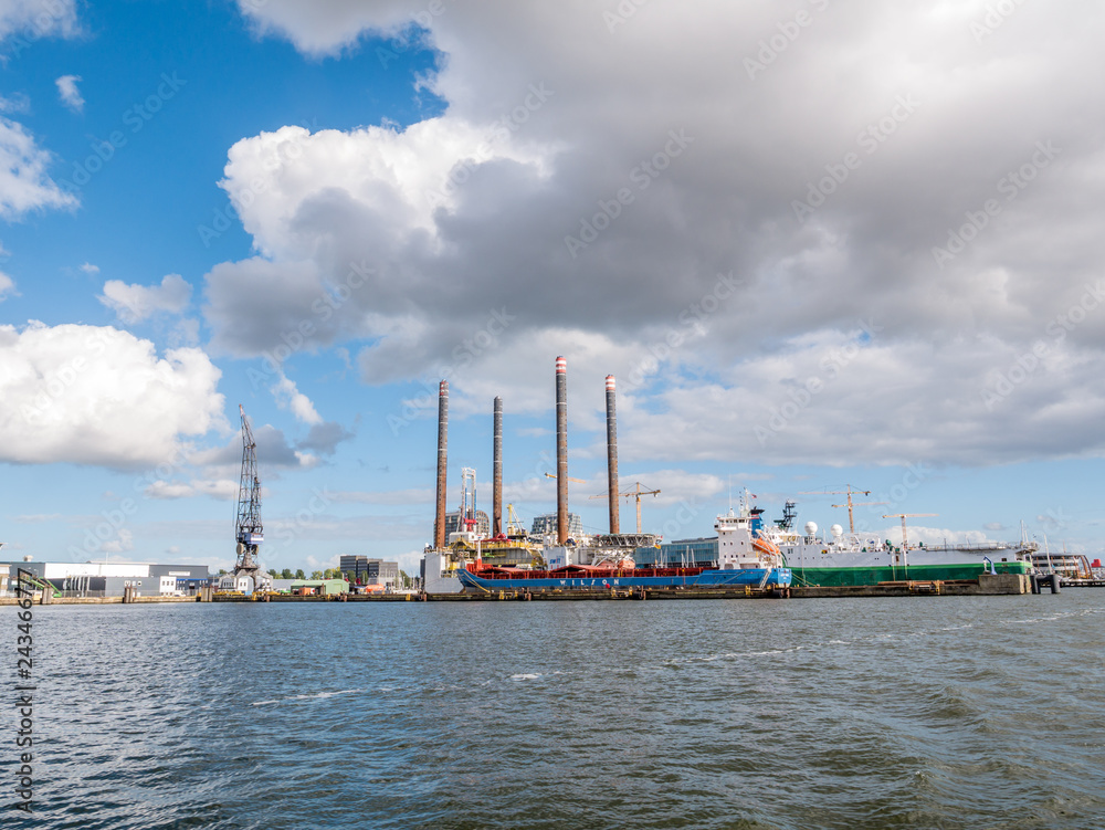 Ships docked in shipyard near NDSM wharf on northern bank of IJ river in Amsterdam, Netherlands