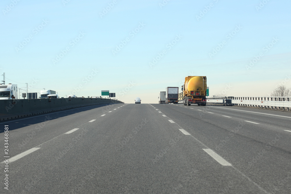 lanes with cars and trucks on italian highway