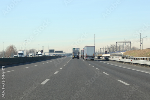lanes with cars and trucks on italian highway