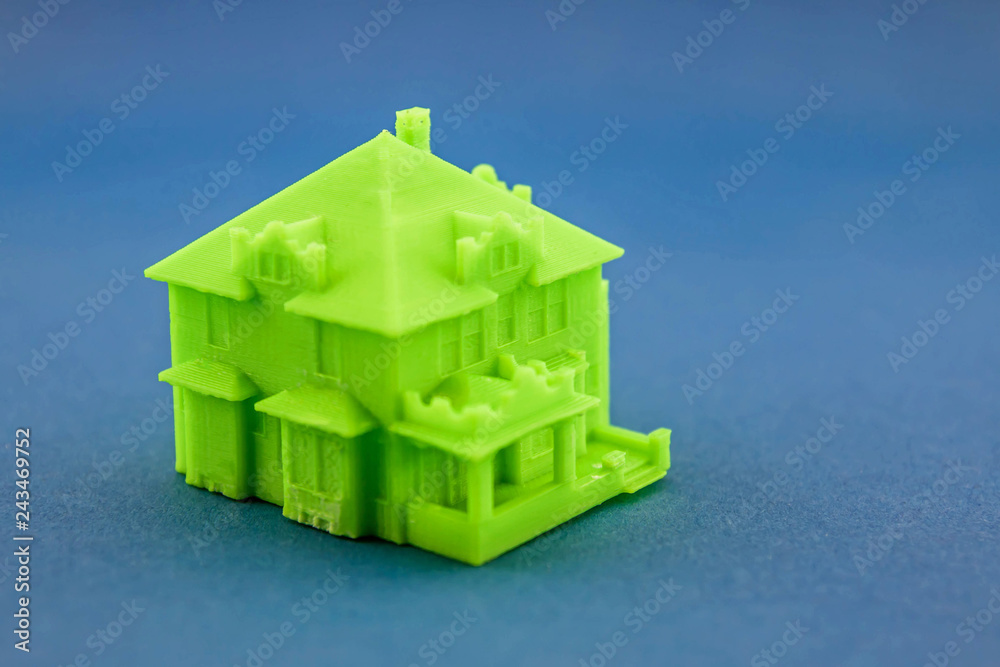 Small green house on blue background