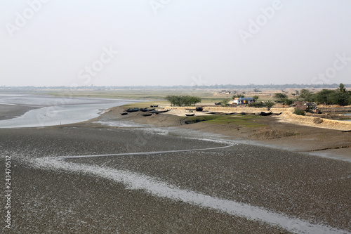 Mud beds on the river Malta during low tide the water in the Canning Town, India  © zatletic