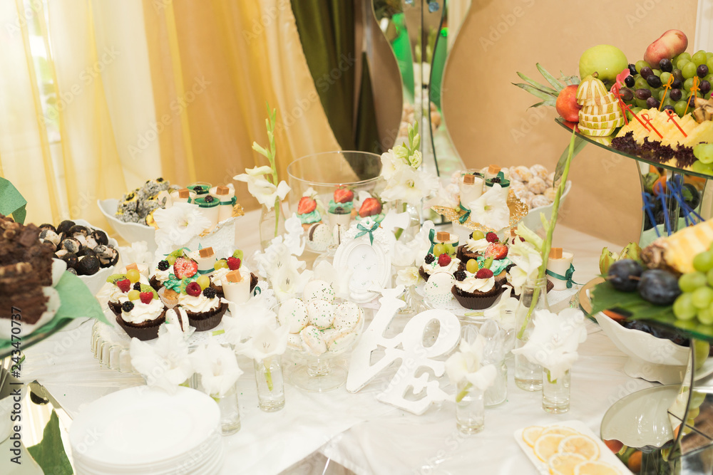 Fototapeta premium Different kinds of baked sweets on a buffet
