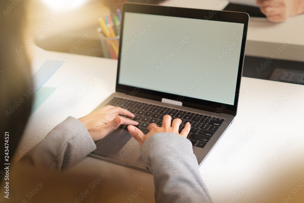 Close up of womans' hands typing on computer in offcie setting Close up of womans' hands typing on computer in offcie setting