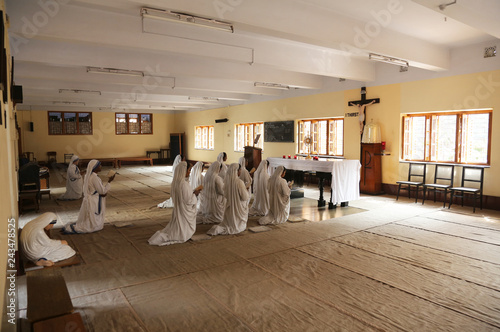 Sisters of Mother Teresa's Missionaries of Charity in prayer in the chapel of the Mother House, Kolkata, India  photo