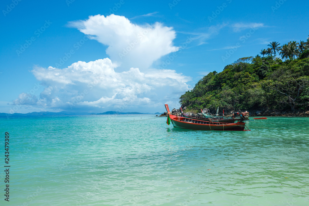 traditional thai boat in a bay of the Koh Racha Yai island in Thailand at the Phuket