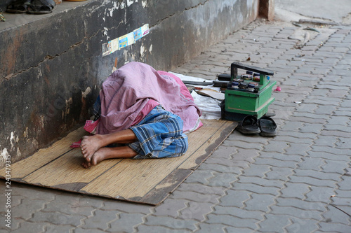 Homeless people sleeping on the footpath of Kolkata