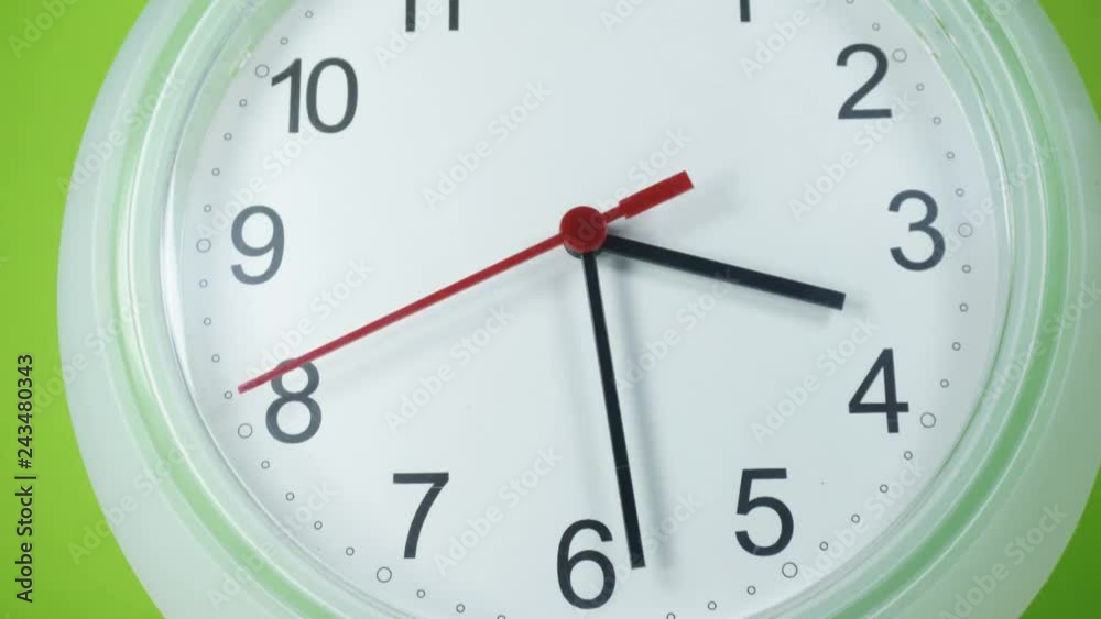 Time Lapse White wall clock. Rush hour Three afternoon on Green background, Clock walking 30 minute, Time concept. Time Lapse White wall clock. Rush hour Three afternoon on Green background, Clock walking 30 minute, Time concept.