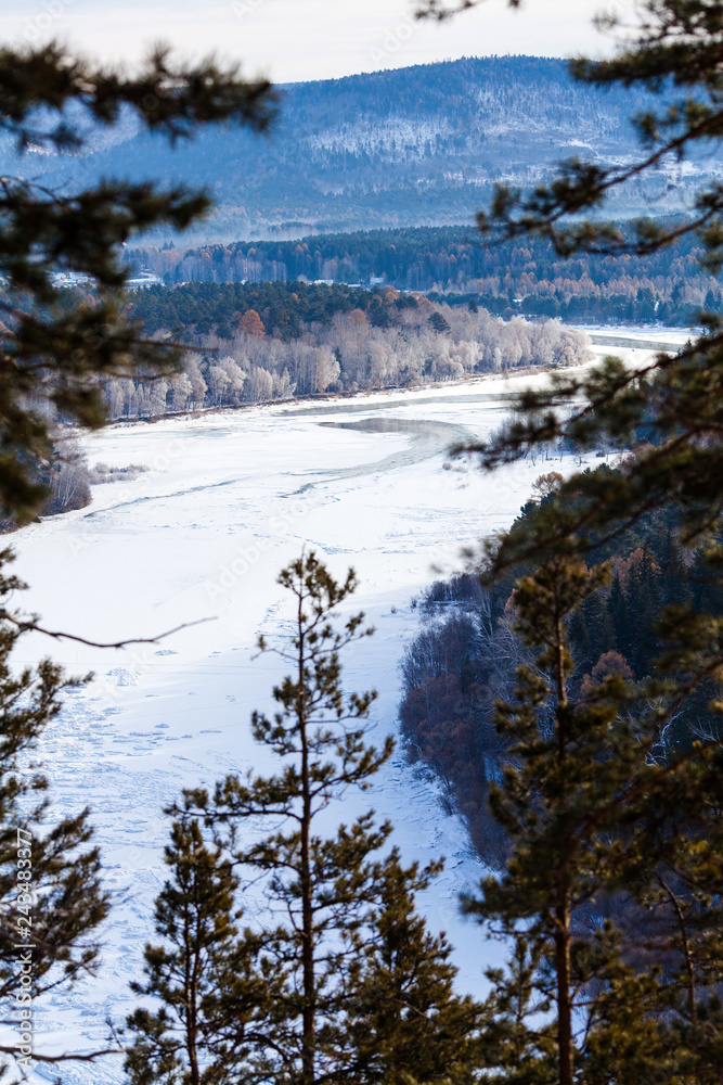 View on the freezing siberian river in winter View on the freezing siberian river in winter