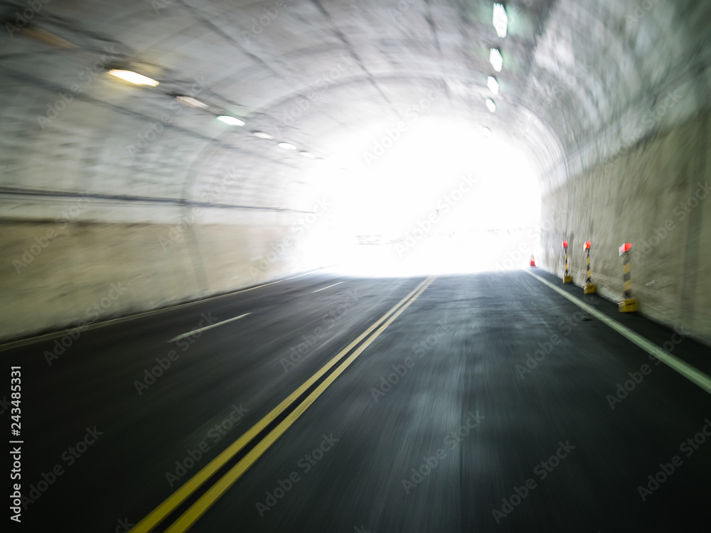 Tunnel exit background. Bright glowing light with motion blur. Tunnel exit background. Bright glowing light with motion blur.