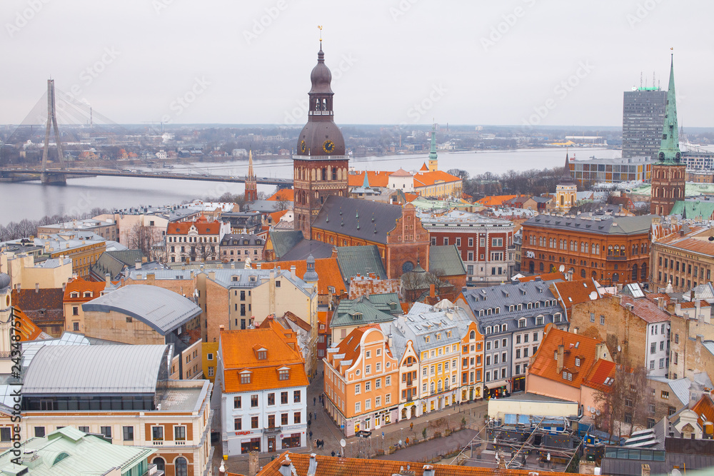 Fototapeta premium Beautiful aerial view of the old town Riga. View of the roofs of the old town from above. Winter season in Riga, Latvia