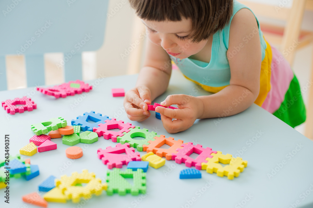 little girl playing with puzzle, early education little girl playing with puzzle, early education