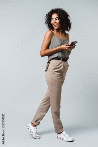 Фототапет Full length of a happy young african woman