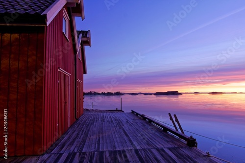 Morning light by the red boathouse photo