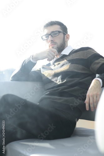 close up.businessman with a cigarette during a coffee break.