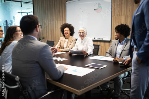 Group of successful business people at work in office