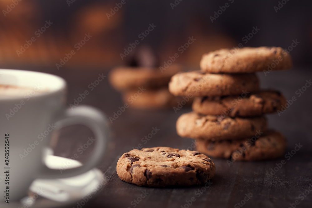 Coffee cup with chocolate cookies on dark old wooden table. Breackfast Coffee cup with chocolate cookies on dark old wooden table. Breackfast