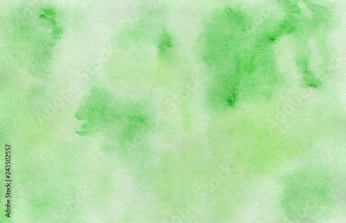 Bright hand painted green watercolor background, wash technique. Summer greenery concept illustration