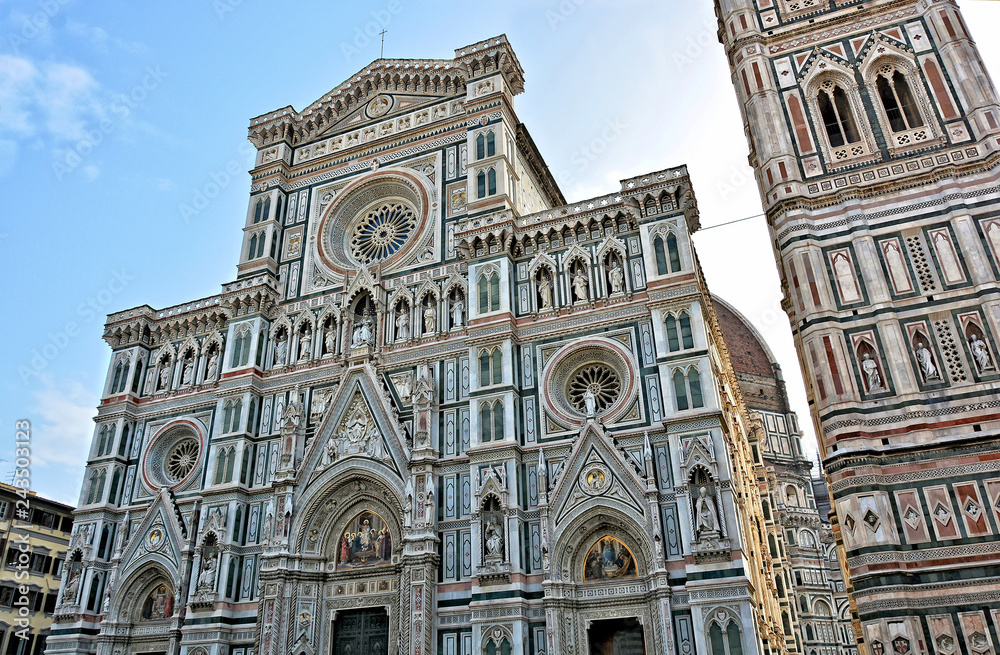 Duomo Florence Cathedral (Santa Maria del Fiore) is the third largest church in the world. Italian Renaissance. Awesome colored marble facade with sculptures and elegant Giotto tower. Italy, Florence