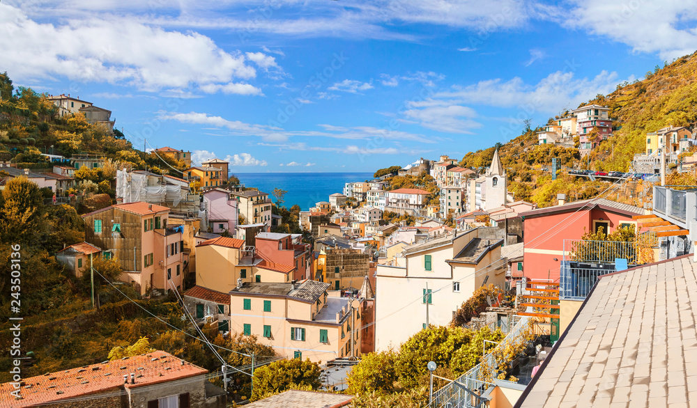 Autumn view of Riomaggiore town and Ligurian Sea