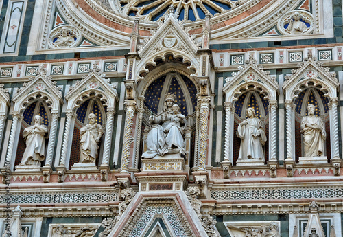 Italian Renaissance. Duomo Florence Cathedral is the third largest church in the world. Architectural details of awesome marble facade with sculptures  painting  rosette. Italy  Florence