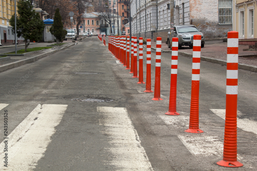 Obraz premium Road orange signs in a highway on reconstruction