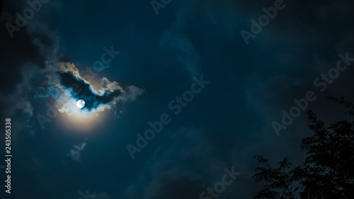 Konstfotografi night sky and astronomy on blue background concept from full moon behind the clo