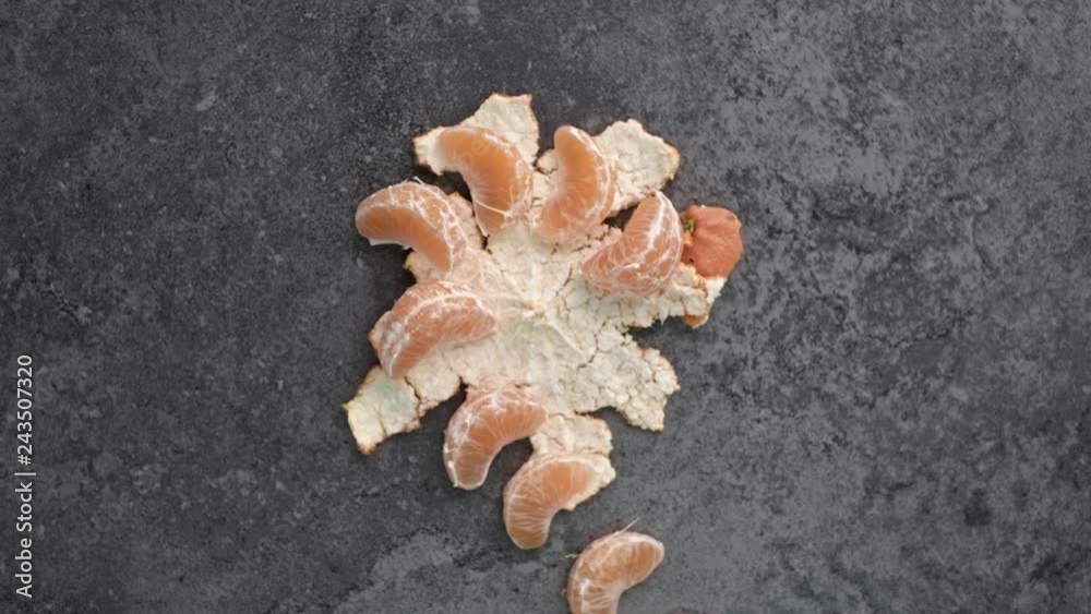 Peeled orange on the black table Peeled orange on the black table
