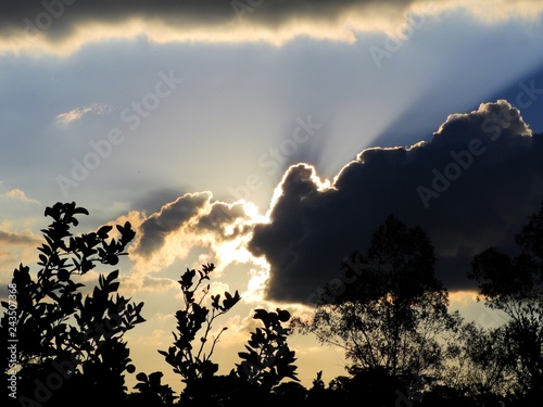 Aerial view of a sunset with sunbeams from forest. Countryside view. Fantastic landscape. Great colors and contrast