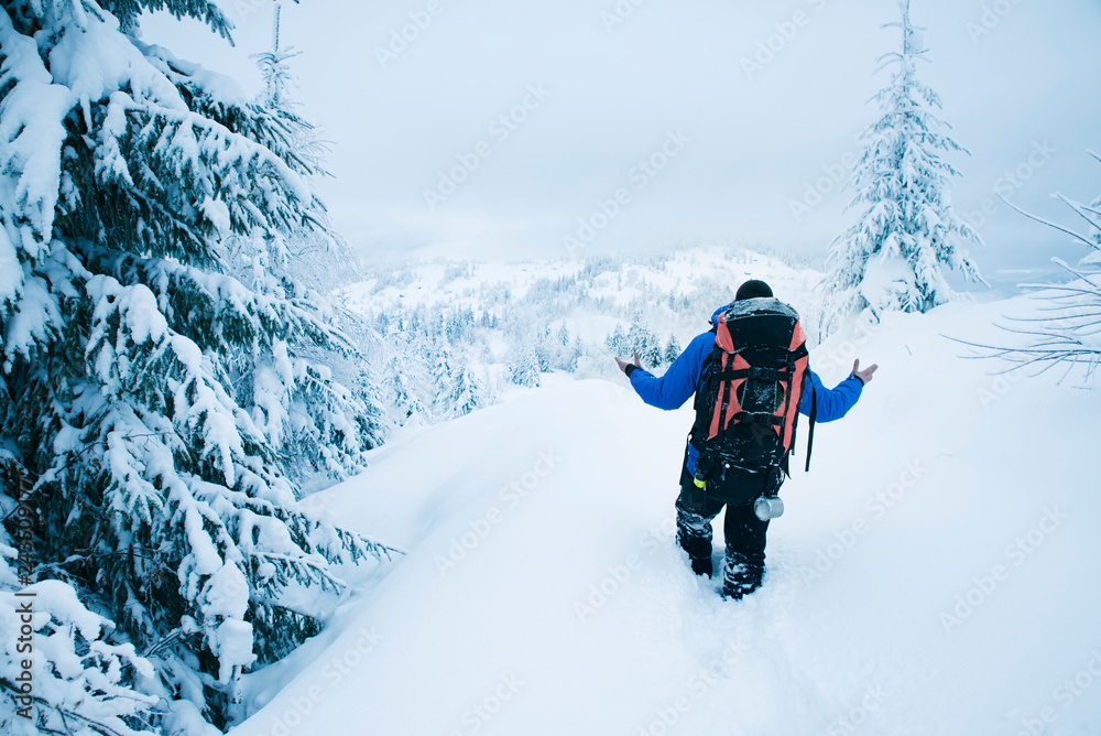 Mountain climber in bad weather during winter