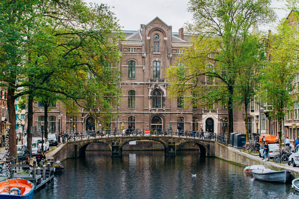 Fototapeta premium Amsterdam, Netherlands September 5, 2017 : Streets, canals and architecture of Amsterdam. Netherlands