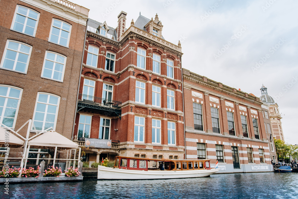 Naklejka premium Amsterdam, Netherlands September 5, 2017: Canal in Amsterdam and buildings