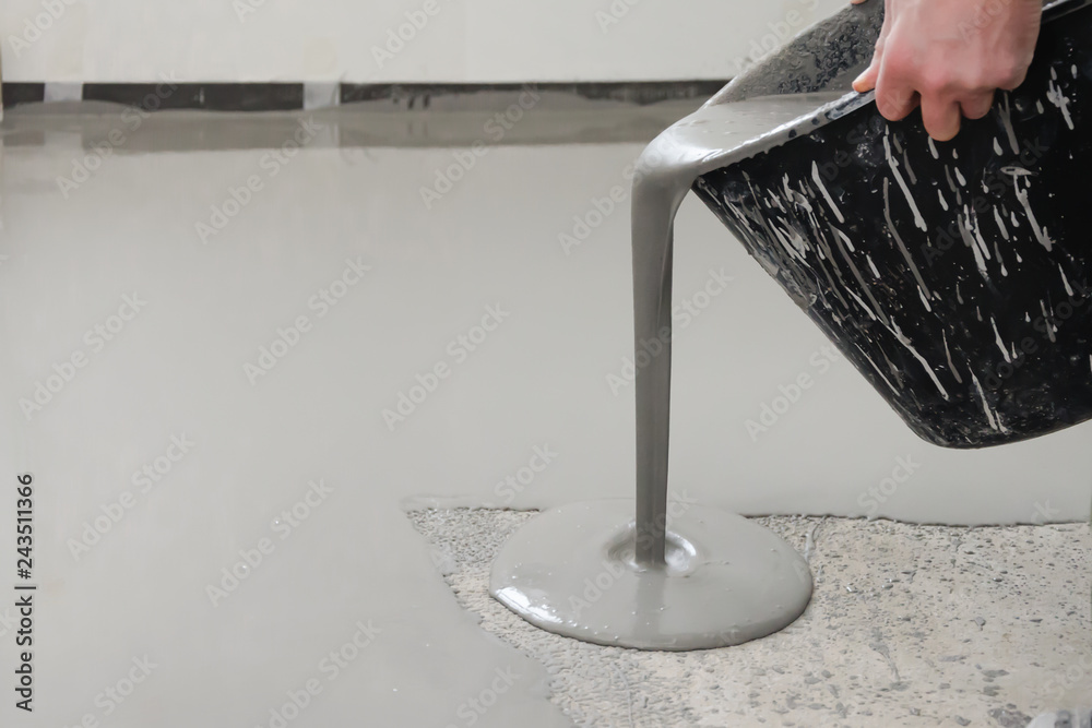 Self-leveling epoxy. Leveling with a mixture of cement floors - obrazy, fototapety, plakaty 