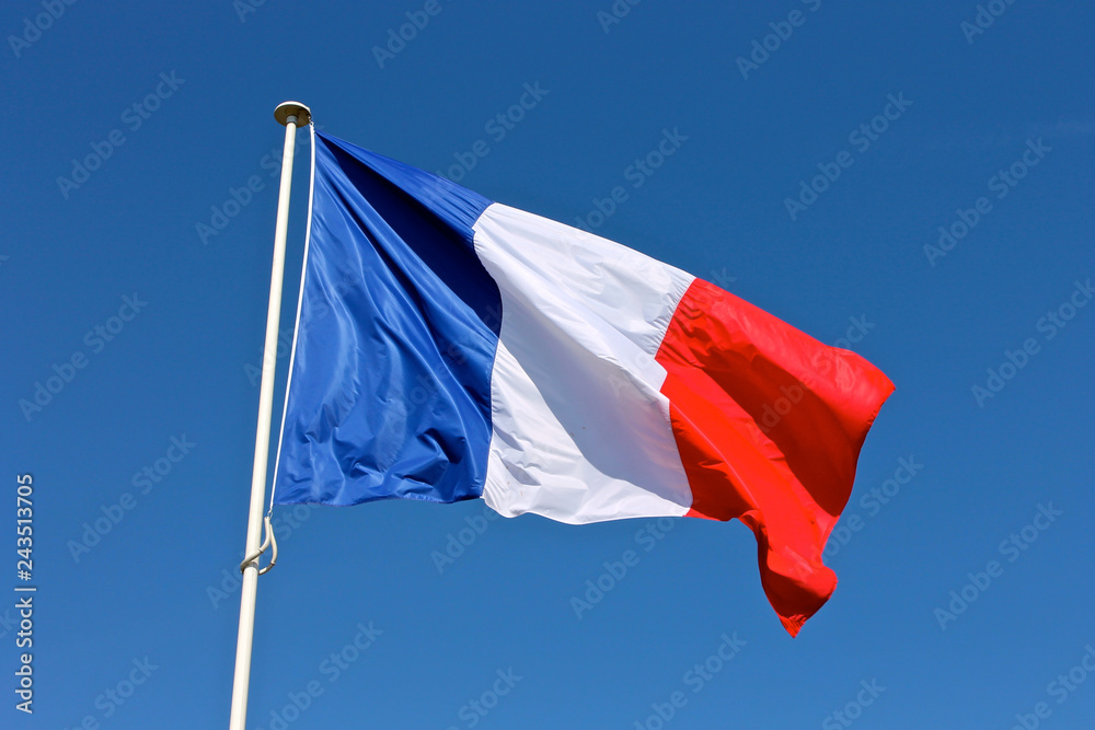 Flag of France waving over a blue sky - obrazy, fototapety, plakaty 