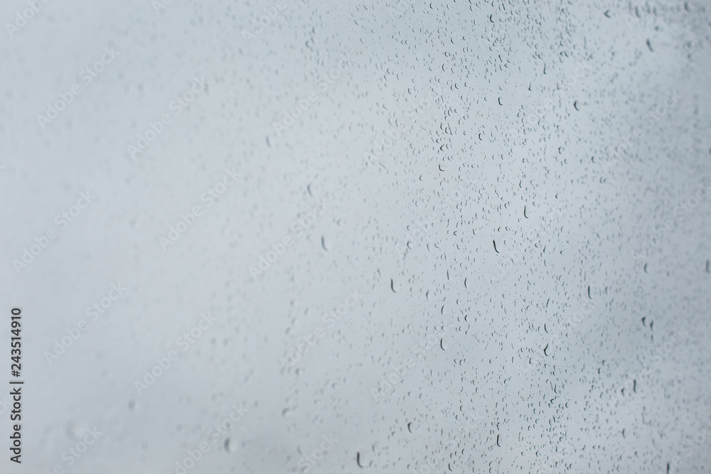 Water drops on the glass. Raindrops on the window in soft focus Water drops on the glass. Raindrops on the window in soft focus