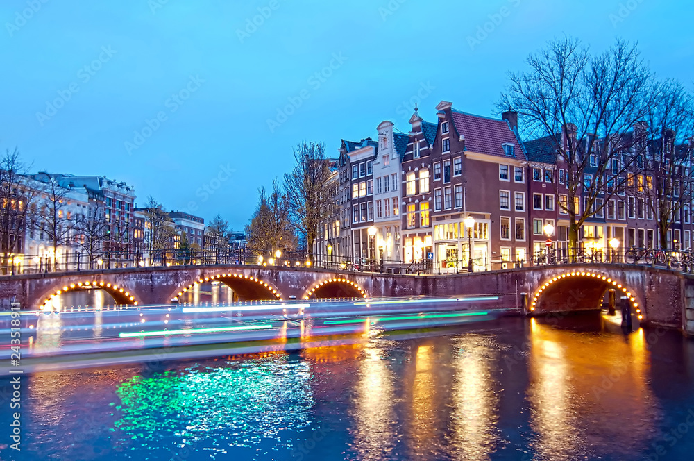 Keizersgracht bridge view of Amsterdam canal and historical houses during twilight time, Netherland.