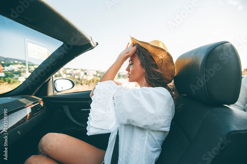 Young attractive woman driv...