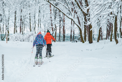 kids skiing in snowed city park
