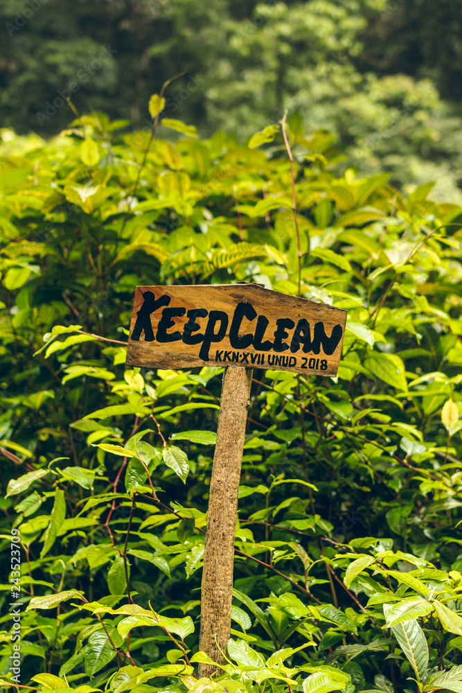 Keep clean wooden sign board in the rainforest of magic island of Bali, Indonesia.