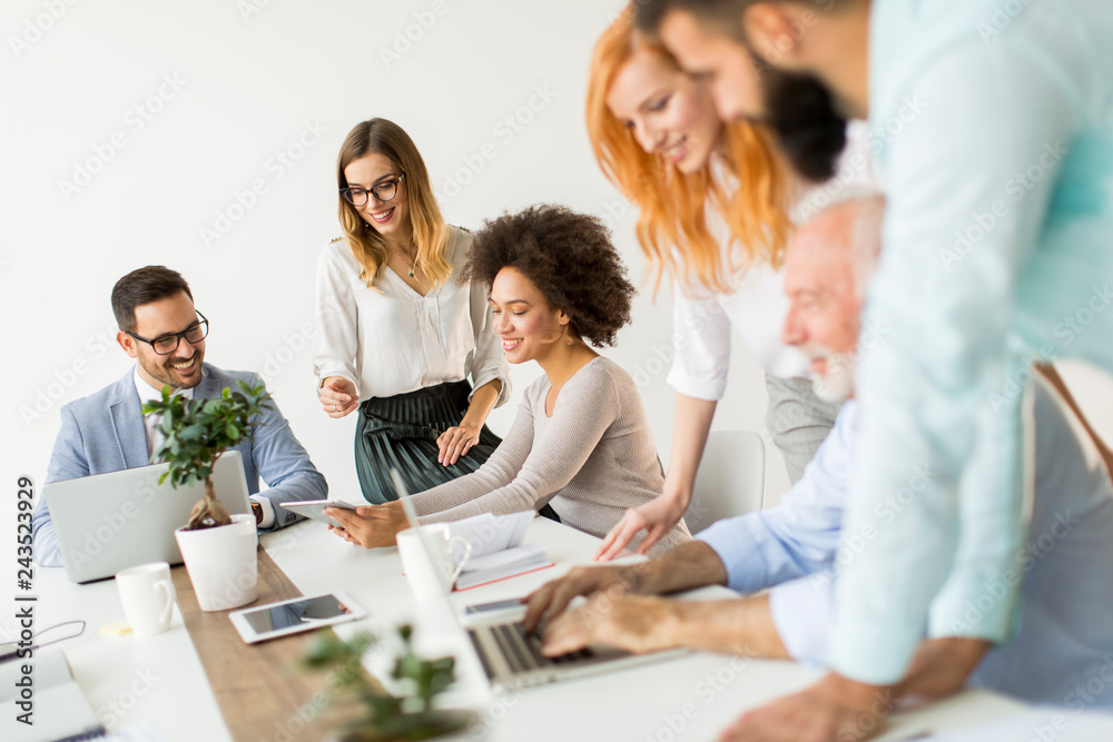Joyful multiracial business team at work in modern office Joyful multiracial business team at work in modern office