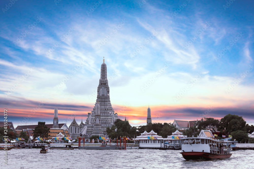 The famous Wat Arun or the Temple of the dawn in evening and beautiful sky in Bangkok Thailand. it is one of the best known landmarks and one of the most popular of Bangkok.