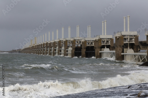 Storm surge barrier to protect against storm and flood