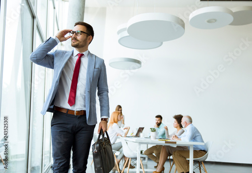 Young businessman leaves a ...