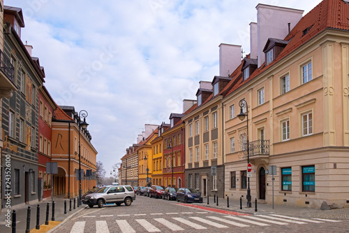 Warsaw, Poland - Typical old town street with XIX century tenements - Koscielna street - in Starowka historic quarter in Warsaw photo