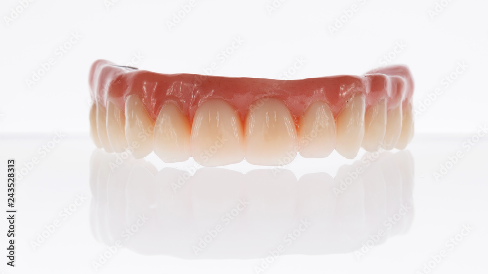 Dental composition of the prosthesis of the upper jaw on a white background